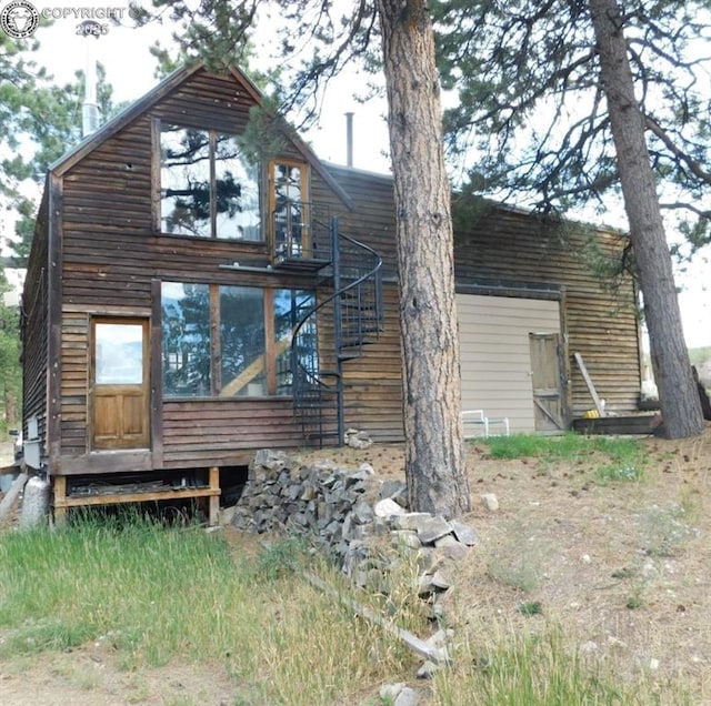 82 County Road 321, Westcliffe, CO 81252 - rear view of property featuring stairs