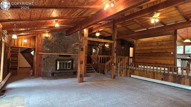 21501 Chalk Creek Dr, Nathrop, CO 81236 - interior space with a ceiling fan, a stone fireplace, wood ceiling, lofted ceiling with beams, and carpet floors