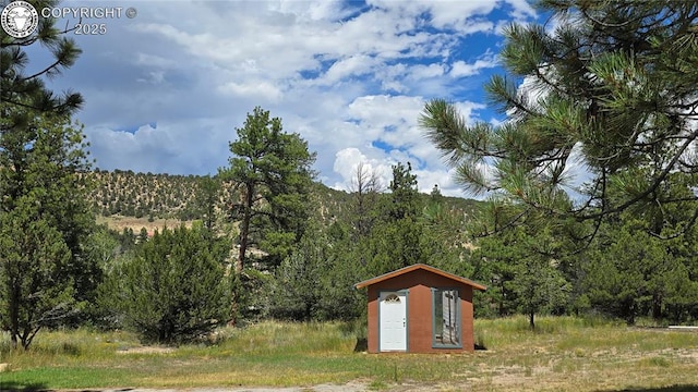21501 Chalk Creek Dr, Nathrop, CO 81236 - view of shed with a forest view