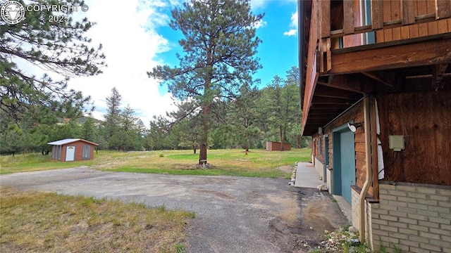 21501 Chalk Creek Dr, Nathrop, CO 81236 - view of yard featuring an outdoor structure and a shed