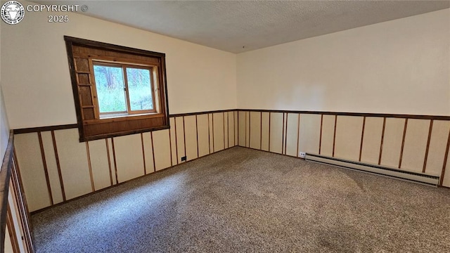 21501 Chalk Creek Dr, Nathrop, CO 81236 - carpeted empty room with a textured ceiling, wainscoting, and baseboard heating