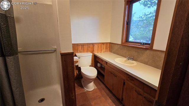 21501 Chalk Creek Dr, Nathrop, CO 81236 - bathroom featuring a wainscoted wall, a wealth of natural light, toilet, and a shower stall