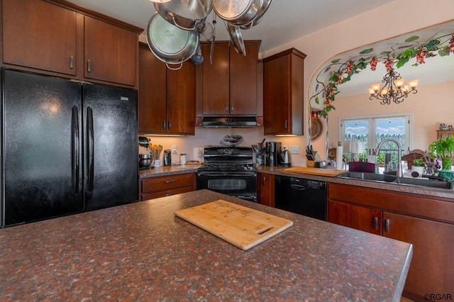 kitchen featuring french doors, sink, a chandelier, and black appliances