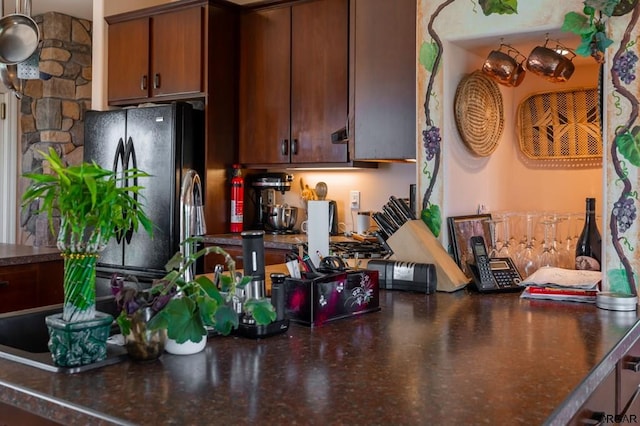 kitchen with black refrigerator