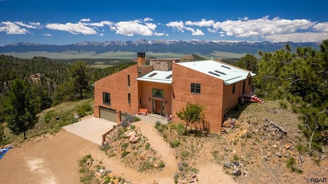 birds eye view of property featuring a mountain view