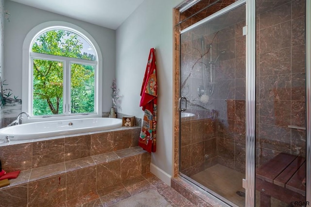 bathroom featuring plus walk in shower