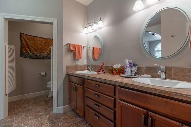 bathroom with vanity and toilet