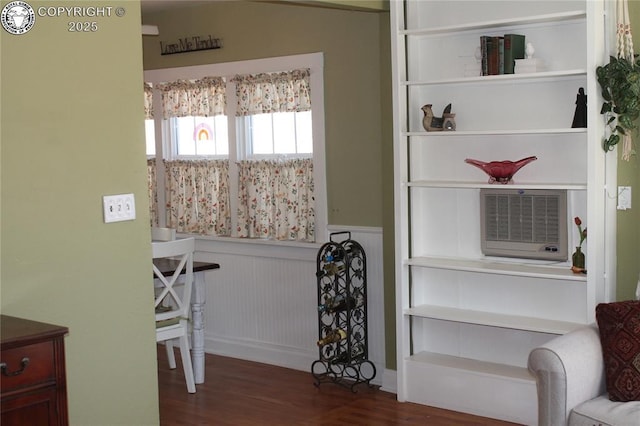 interior space with dark wood-style floors and wainscoting