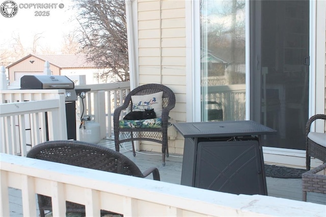 wooden deck featuring grilling area