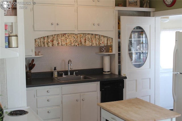 kitchen featuring white cabinetry, a sink, and open shelves