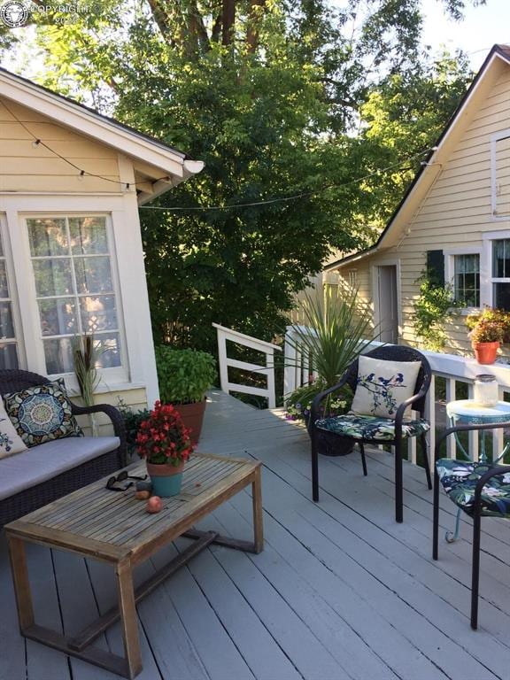 deck with an outdoor hangout area