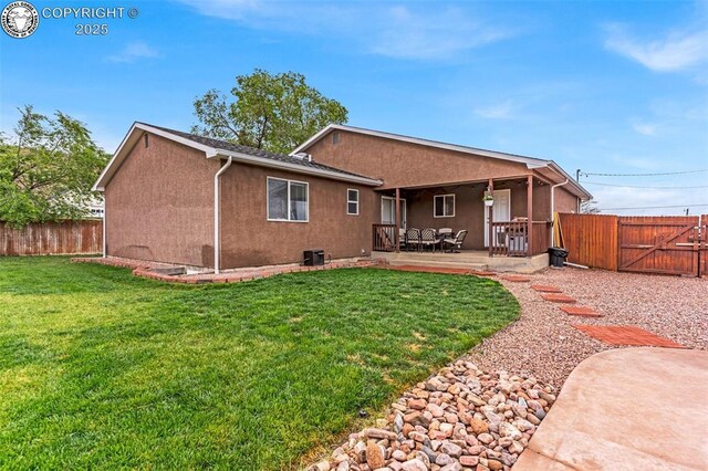 3065 Pear St, Canon City, CO 81212 - rear view of house featuring stucco siding, a patio, and a gate