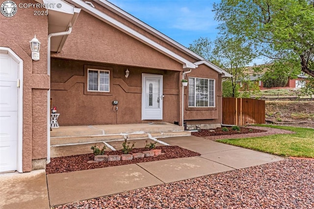 3065 Pear St, Canon City, CO 81212 - view of exterior entry with fence and stucco siding