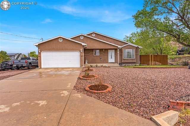 3065 Pear St, Canon City, CO 81212 - ranch-style home with driveway, an attached garage, fence, and stucco siding