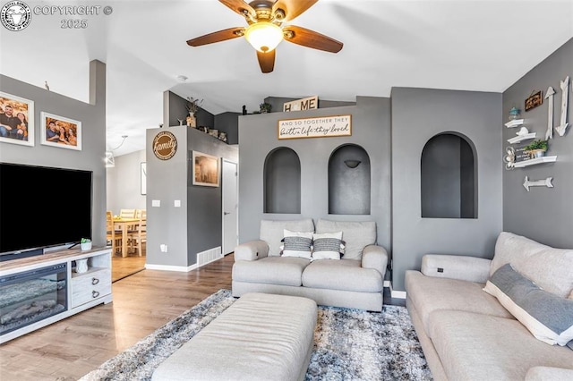 3065 Pear St, Canon City, CO 81212 - living room featuring a ceiling fan, wood finished floors, baseboards, and vaulted ceiling