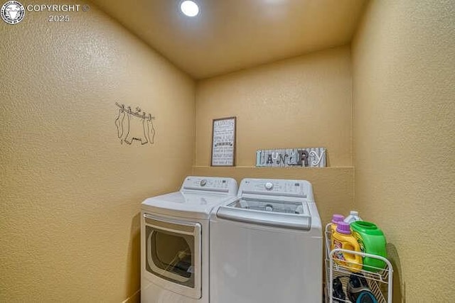 336 Arrowhead Dr, Florence, CO 81226 - laundry area with washing machine and clothes dryer, a textured wall, and recessed lighting