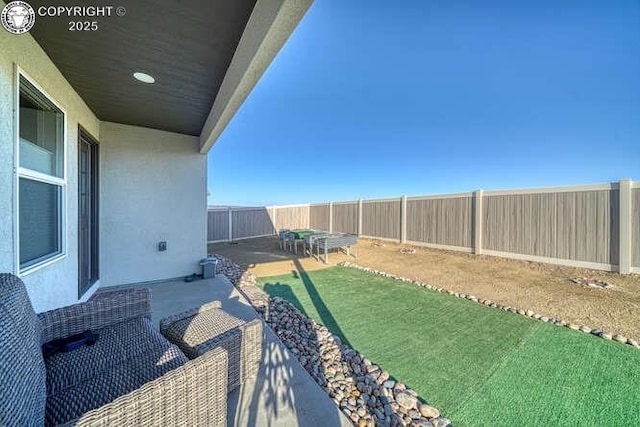 336 Arrowhead Dr, Florence, CO 81226 - fenced backyard with a patio area