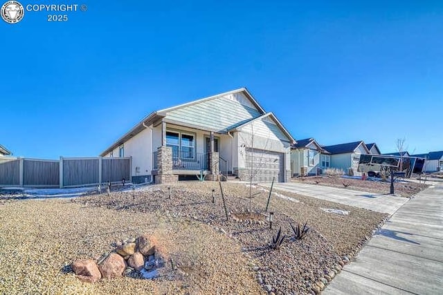 336 Arrowhead Dr, Florence, CO 81226 - view of front of property featuring an attached garage, concrete driveway, a porch, and stucco siding