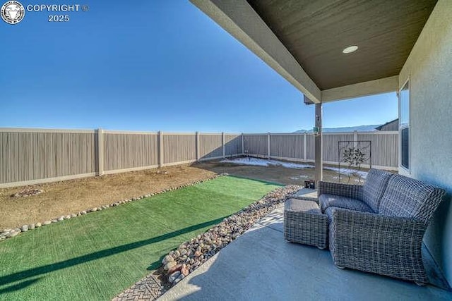 336 Arrowhead Dr, Florence, CO 81226 - fenced backyard featuring a patio area and an outdoor living space