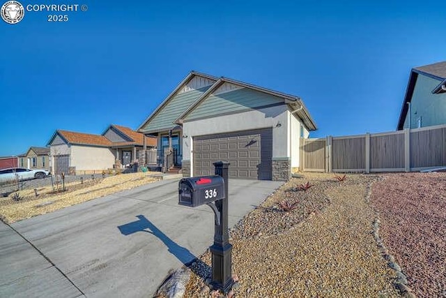 336 Arrowhead Dr, Florence, CO 81226 - ranch-style house featuring driveway, an attached garage, and stone siding