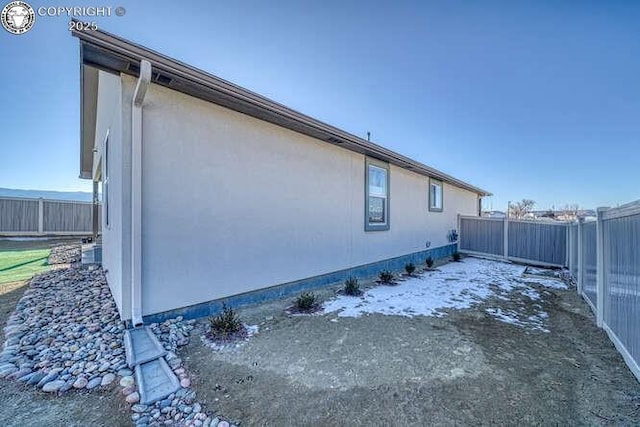 336 Arrowhead Dr, Florence, CO 81226 - view of side of property featuring a fenced backyard and stucco siding