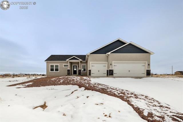 view of front facade featuring central AC unit, an attached garage, and stucco siding