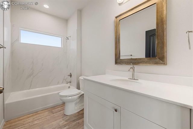 full bathroom featuring recessed lighting, toilet, vanity, wood finished floors, and  shower combination