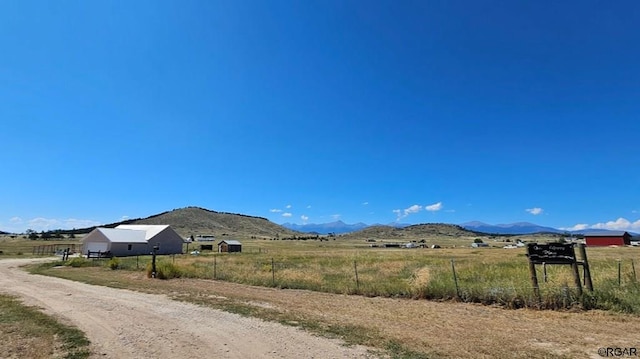 property view of mountains featuring a rural view