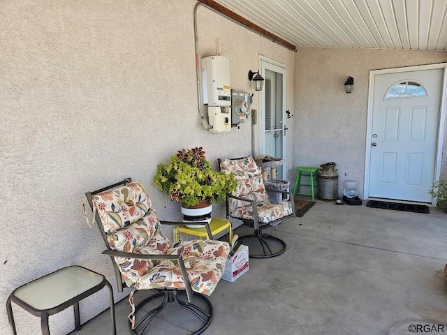 view of patio featuring water heater