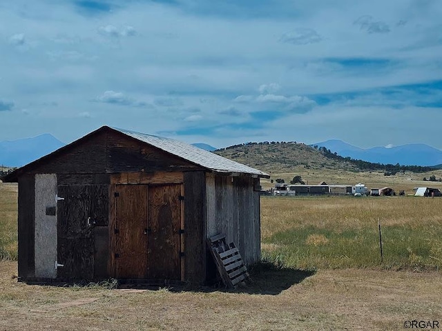 view of outbuilding with a mountain view