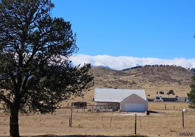 view of mountain feature featuring a rural view