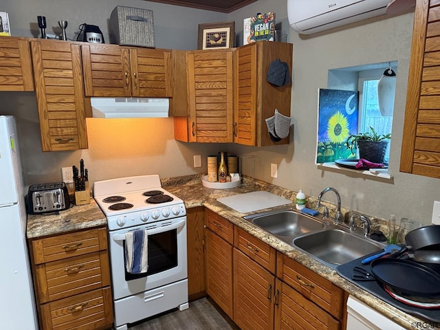 kitchen featuring dark hardwood / wood-style floors, a wall mounted air conditioner, sink, light stone counters, and white appliances