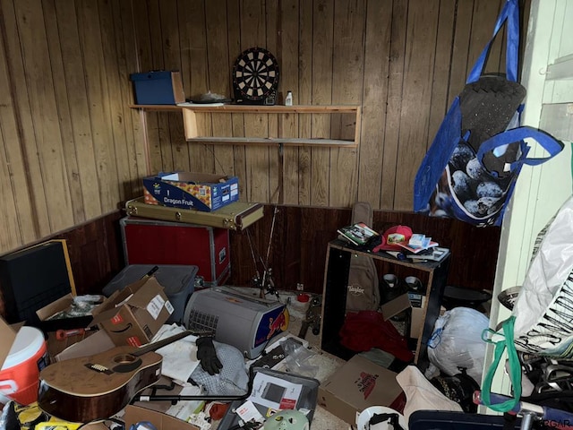 misc room featuring wooden walls