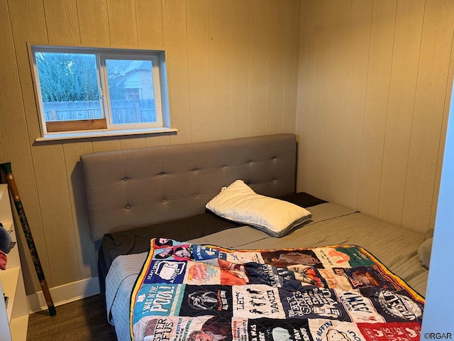 bedroom featuring dark hardwood / wood-style flooring