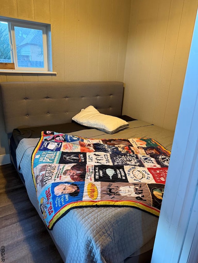 bedroom with wooden walls