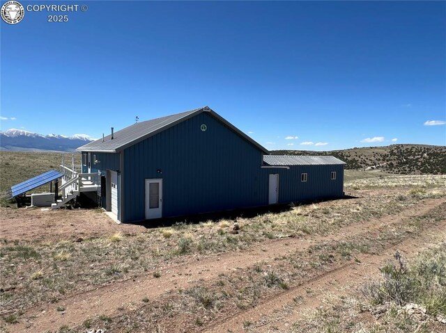 5105 Electric Ave, Westcliffe, CO 81252 - view of home's exterior featuring a mountain view, metal roof, and cooling unit