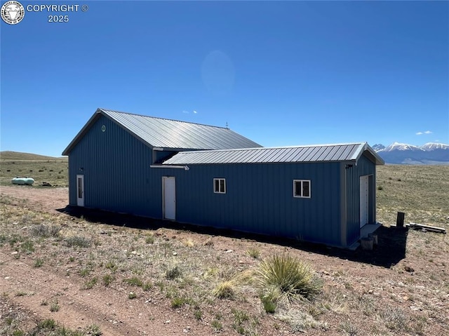 5105 Electric Ave, Westcliffe, CO 81252 - view of property exterior with metal roof and a mountain view