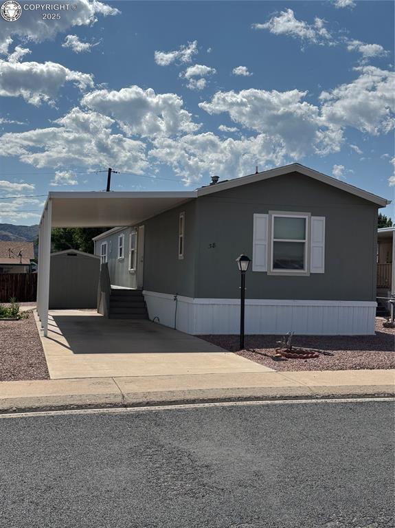 860 Zona St Unit 38, Canon City, CO 81212 - manufactured / mobile home featuring a carport