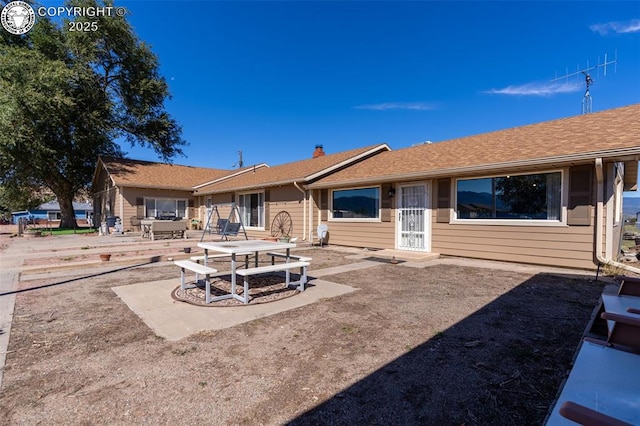 rear view of property with a patio area