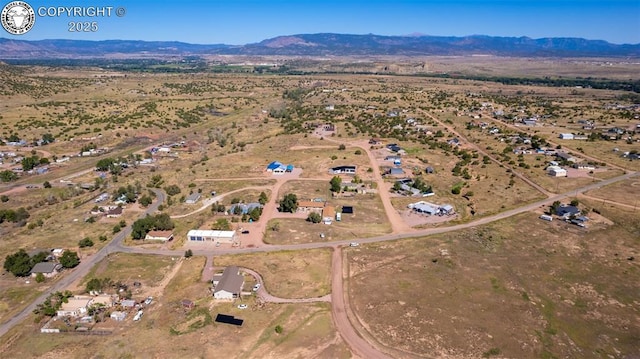 bird's eye view with a mountain view