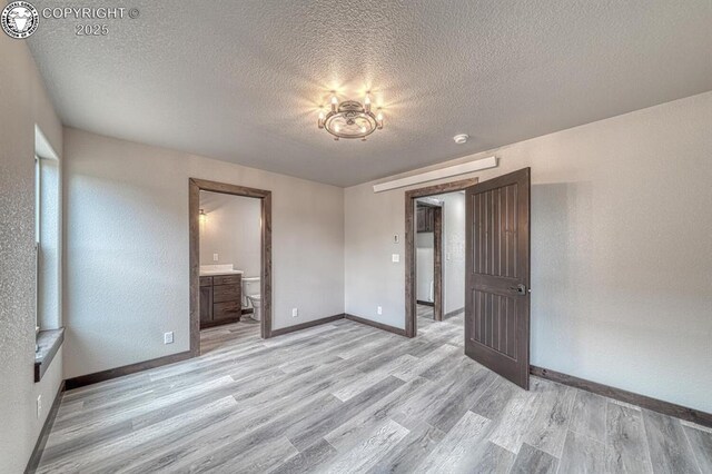 306 Fox Run E, Silver Cliff, CO 81252 - spare room featuring light wood finished floors and a textured ceiling