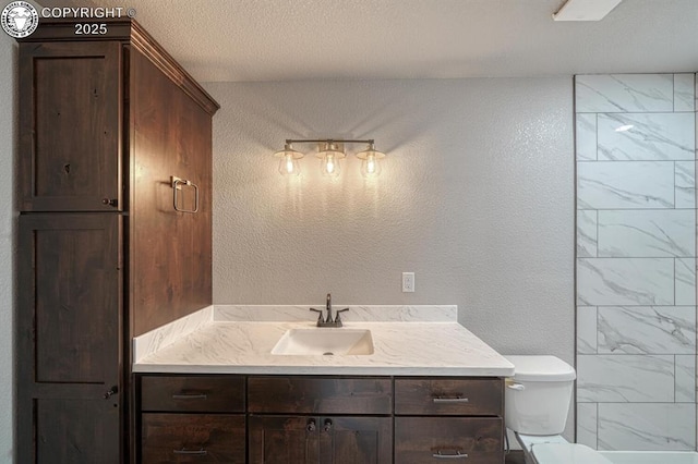 306 Fox Run E, Silver Cliff, CO 81252 - bathroom featuring vanity and a textured wall