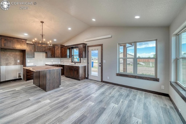 306 Fox Run E, Silver Cliff, CO 81252 - kitchen featuring a kitchen island, a chandelier, light wood-type flooring, plenty of natural light, and recessed lighting