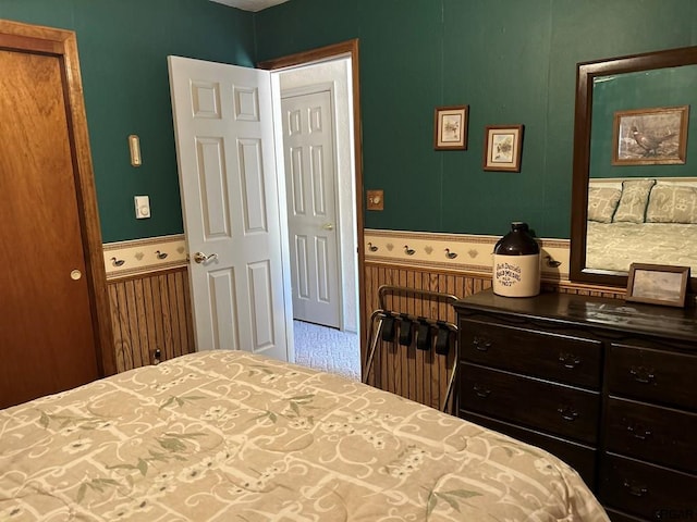 bedroom with wooden walls