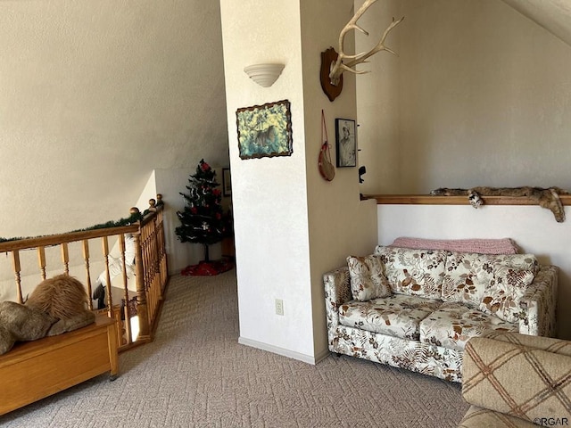 interior space with vaulted ceiling and light carpet