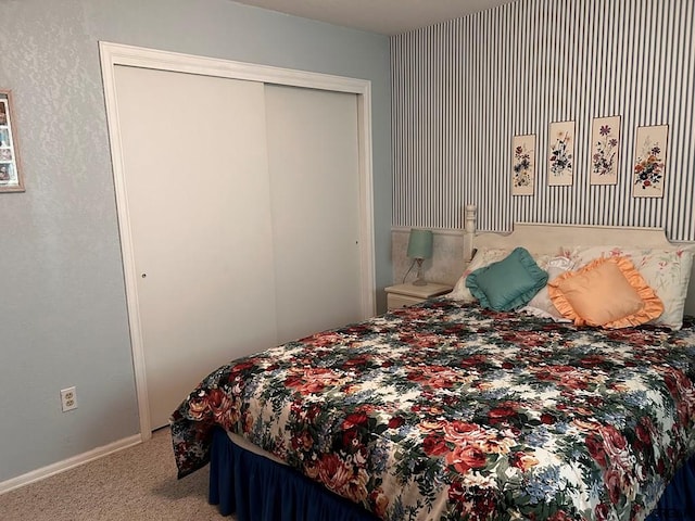 carpeted bedroom with a closet