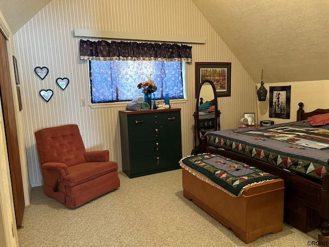 carpeted bedroom with vaulted ceiling and a textured ceiling