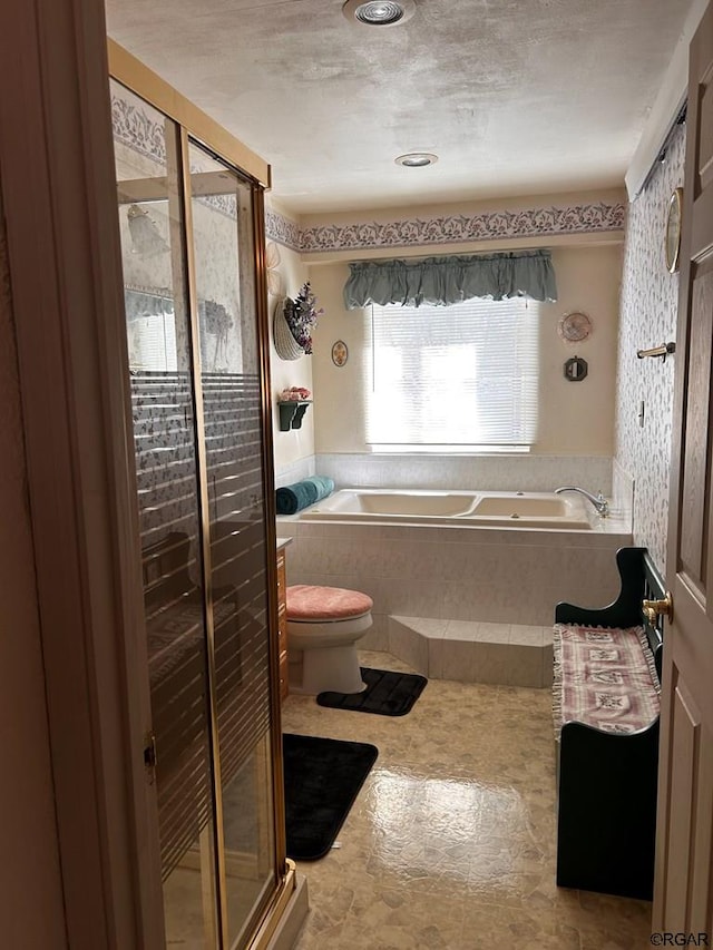 bathroom with independent shower and bath and toilet