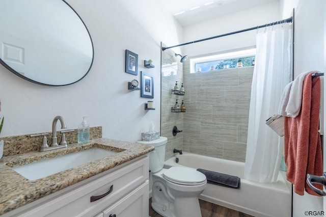 full bathroom with vanity, hardwood / wood-style floors, shower / bathtub combination with curtain, and toilet