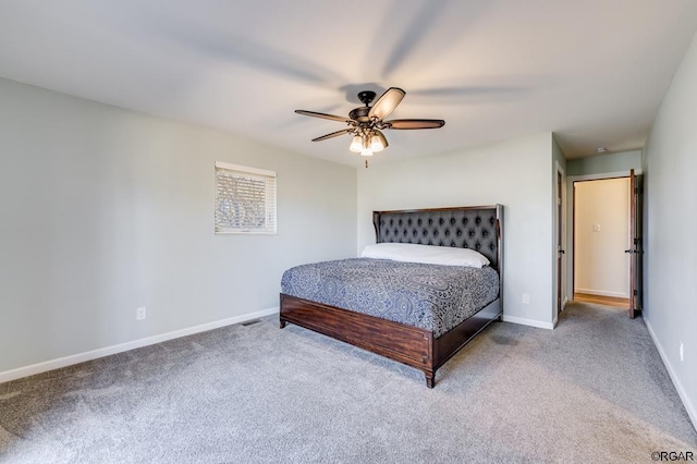 bedroom featuring ceiling fan and carpet